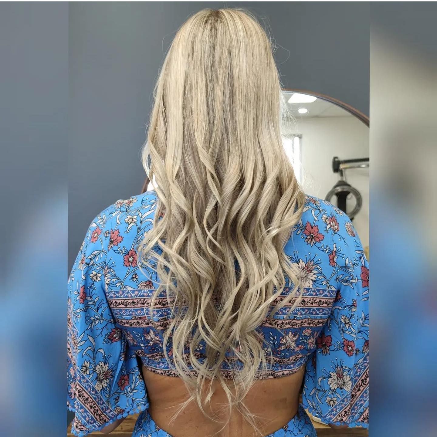 Hairdresser On The Sunshine Coast Showcasing Long Blonde Wavy Hairstyle