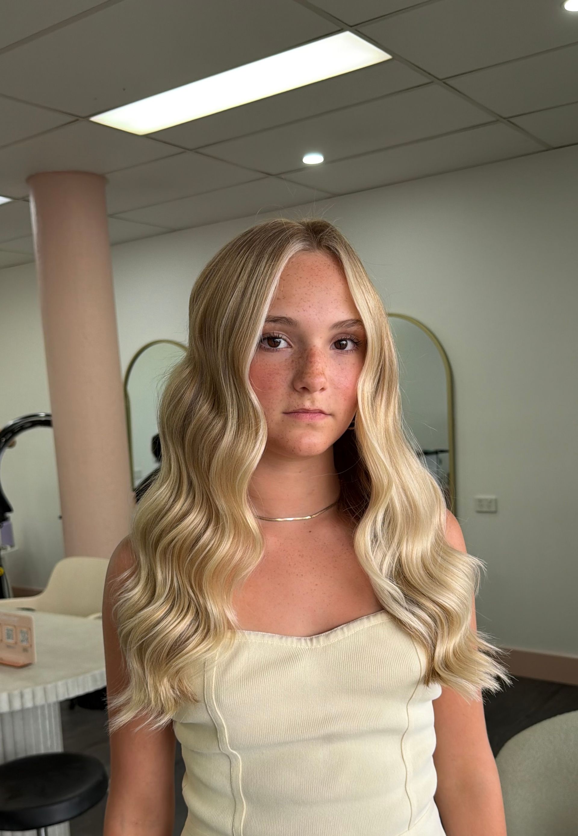 A Person With Long, Wavy Blonde Hair — Oh So Blonde Hair Studio in Buddina, QLD