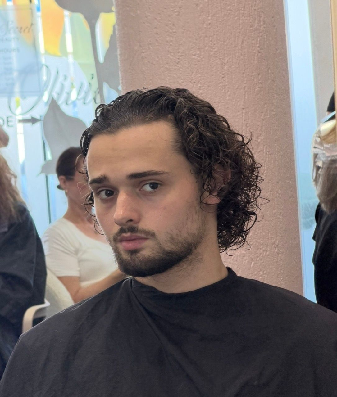 Person In A Salon Cape Seen In A Mirror, Getting A Haircut In A Chair — Oh So Blonde Hair Studio in Buddina, QLD
