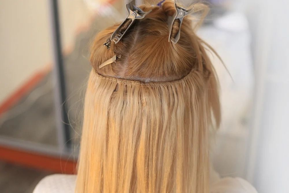Woman's Blonde Hair With Weft Extensions — Oh So Blonde Hair Studio in Buddina, QLD
