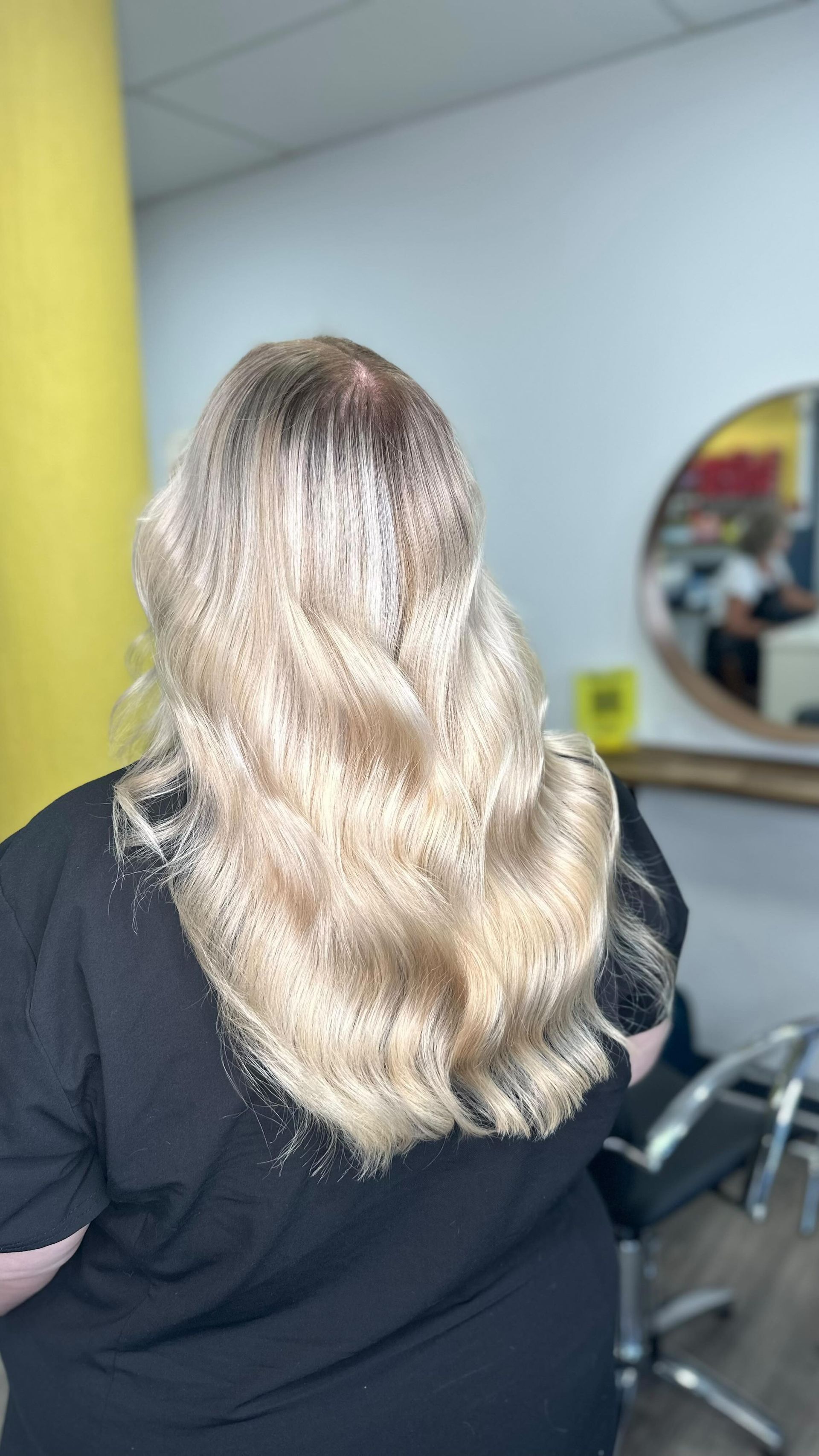 Woman With Long, Wavy Blonde Hair in a Salon — Oh So Blonde Hair Studio in Buddina, QLD