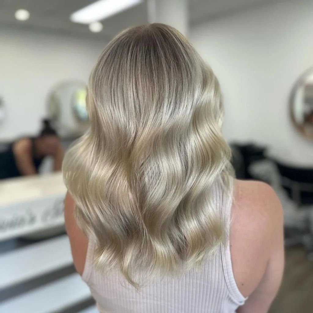 Woman With Wavy, Blonde Hair, in a Salon Setting — Oh So Blonde Hair Studio in Buddina, QLD