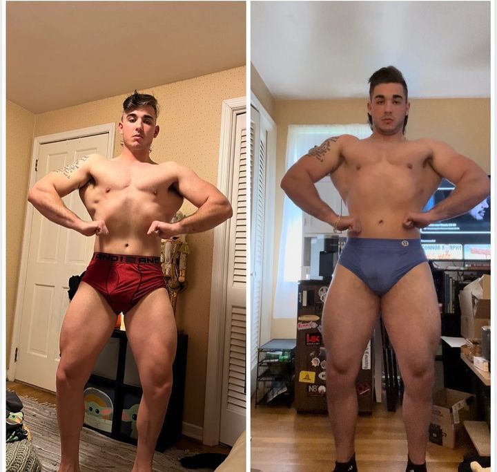 Two muscular men pose in underwear, flexing their physique. One in red, one in blue. Both indoors.