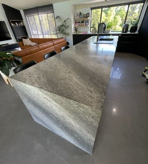 kitchen with granite countertop and yellow accents