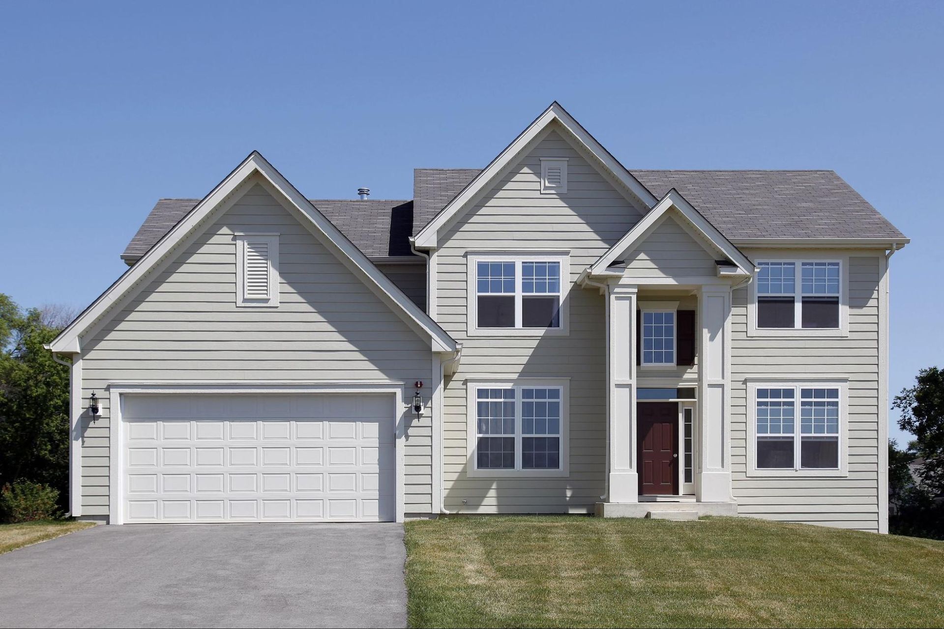 A large house with a garage and a driveway