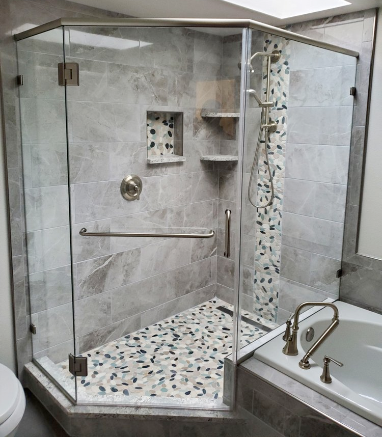 A bathroom with a walk in shower and a bathtub.