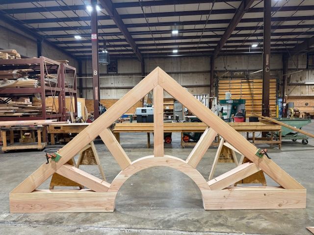 A timber truss shaped like a sunrise