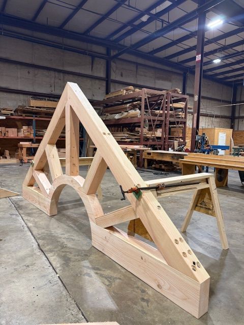 A timber truss shaped like a sunrise