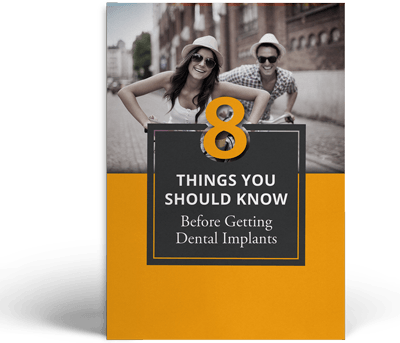 A book titled things you should know before getting dental implants
