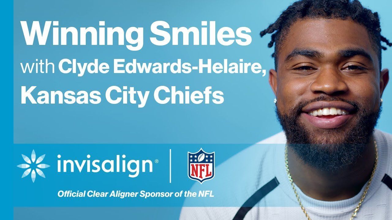 A man is smiling in an advertisement for invisalign