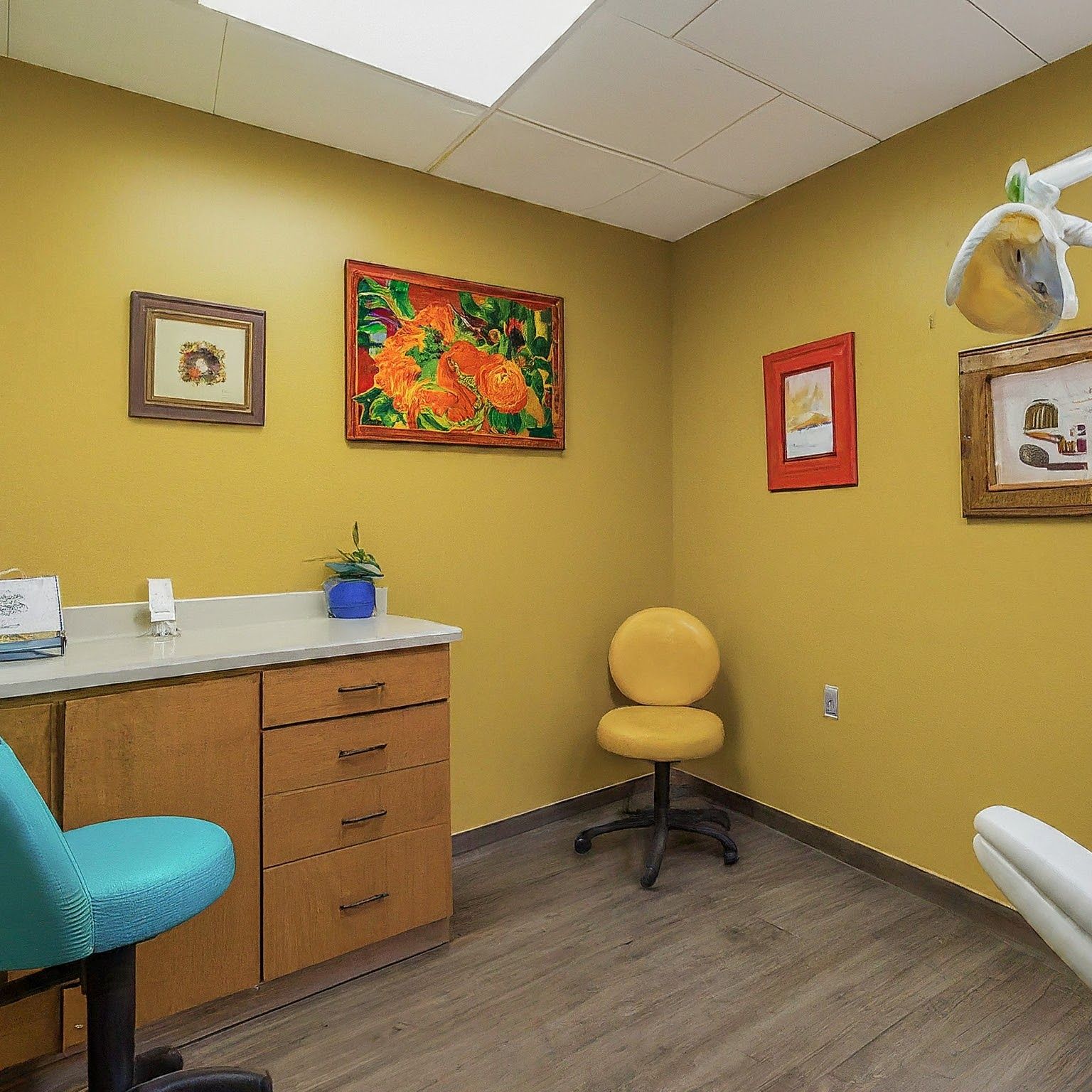 A dental office with yellow walls and a yellow chair.