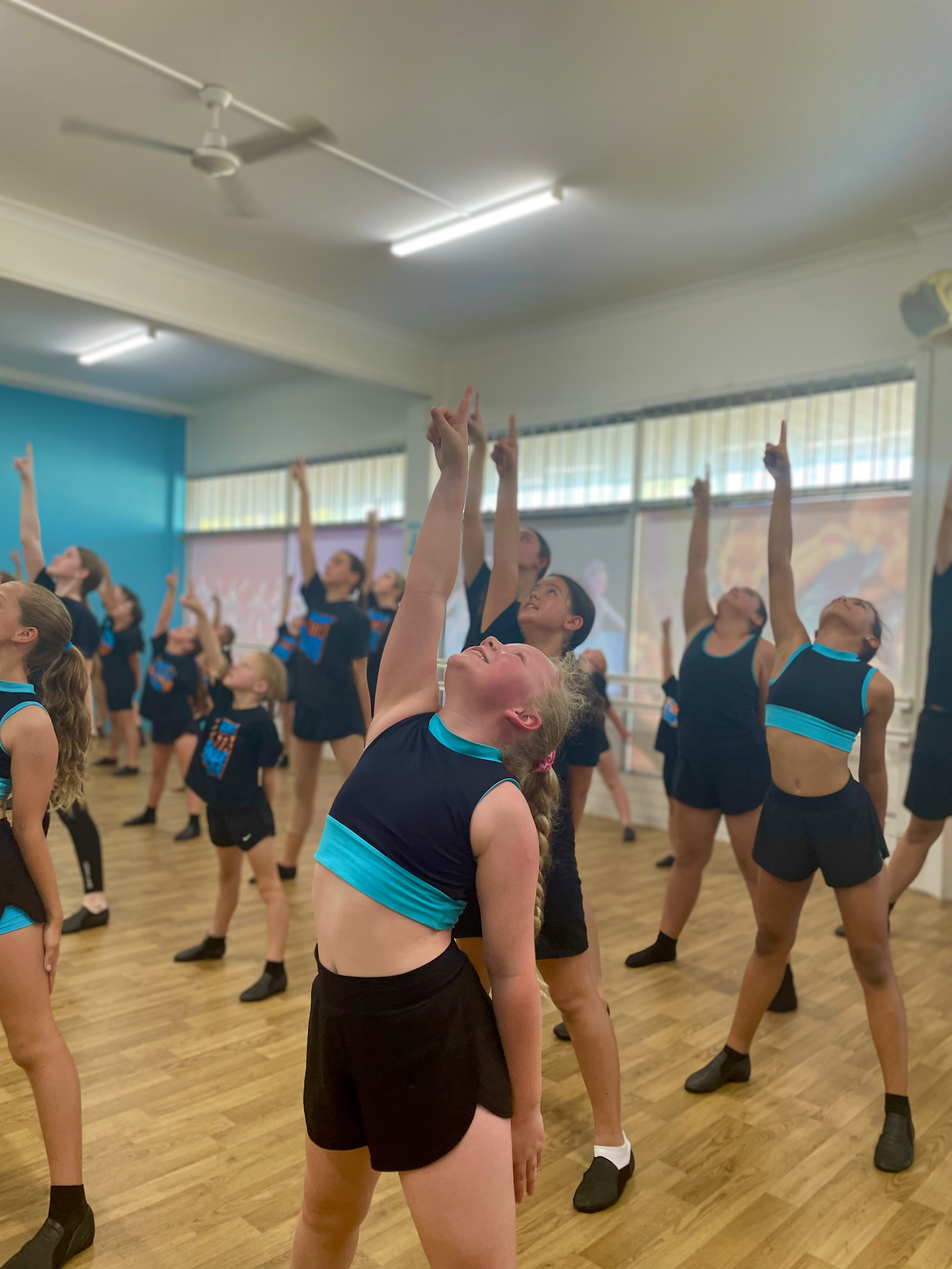 Two Young Girls Are Posing For A Picture In A Dance Studio — Dance Express Mackay In North Mackay, QLD