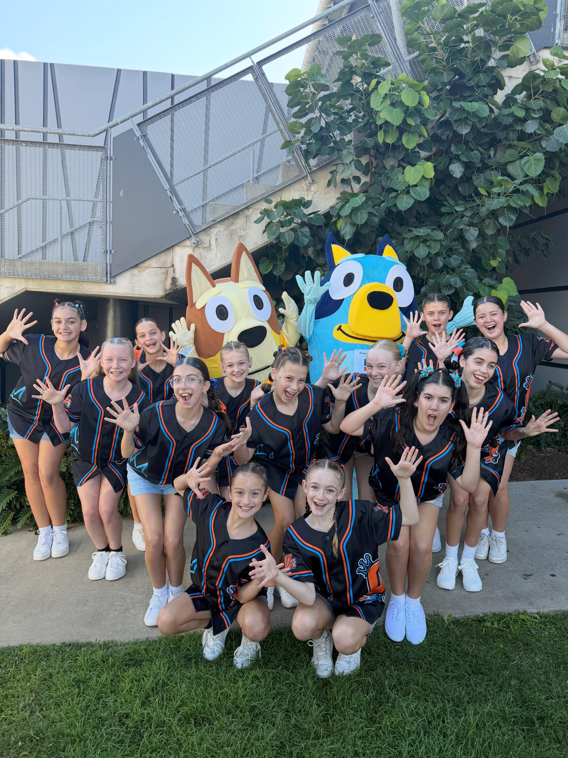 A Group Of Young Girls Are Posing For A Picture With A Mascot — Dance Express Mackay In North Mackay, QLD
