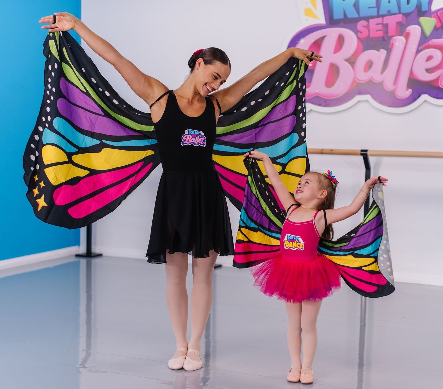 A Little Girl In A Pink And Blue Dress Is Standing In A Room — Dance Express Mackay In North Mackay, QLD