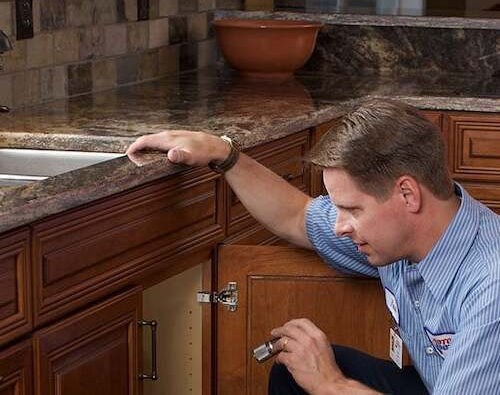 Roto-Rooter Tech under sink faucet