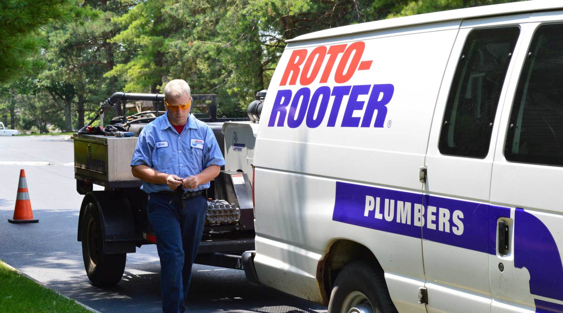 tech with plumber truck and trailer