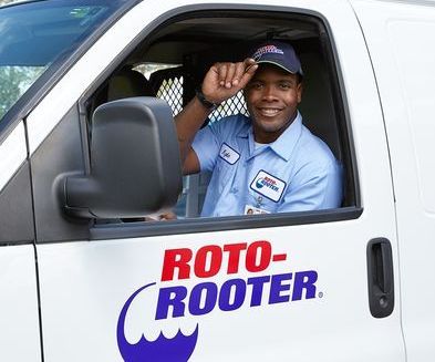Roto-Rooter tech in truck