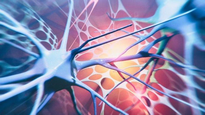 A close up of a brain cell with a light coming out of it