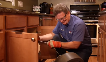 Plumber Fixing Sink — Battle Creek, MI — Roto Rooter