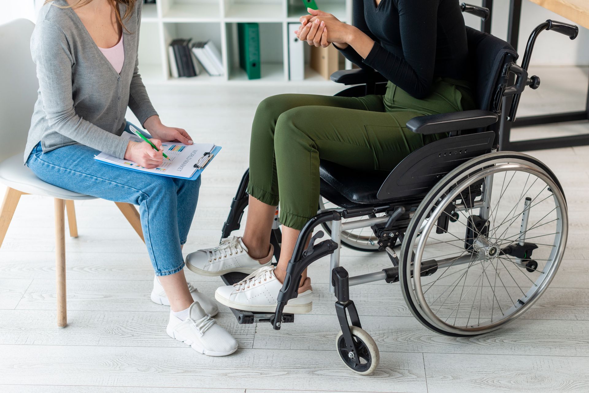 Therapist conducting a wheelchair evaluation.