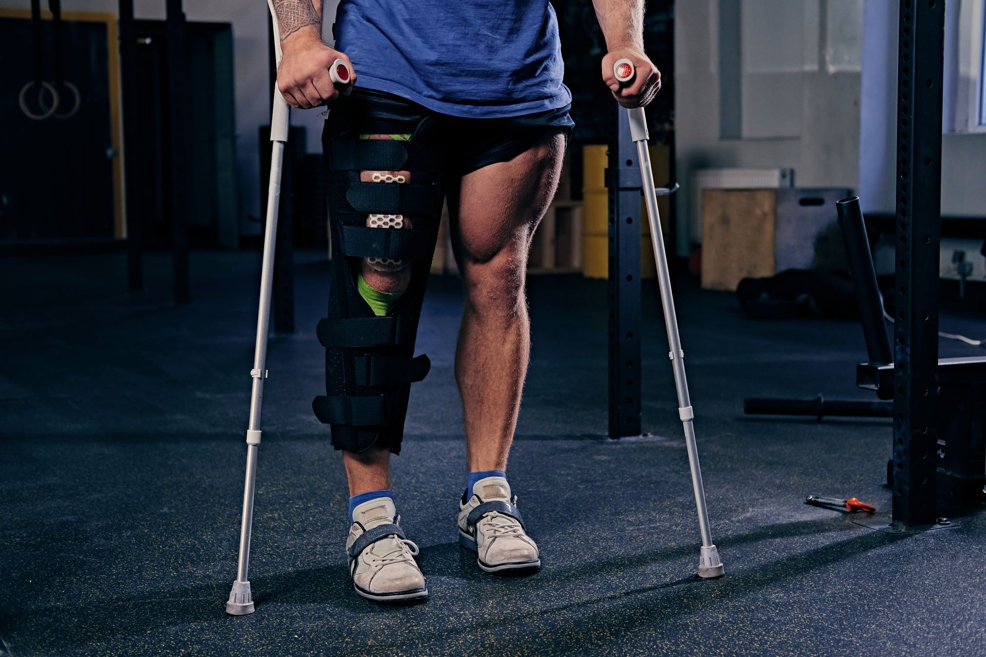 Patient using crutches after post-op knee surgery.