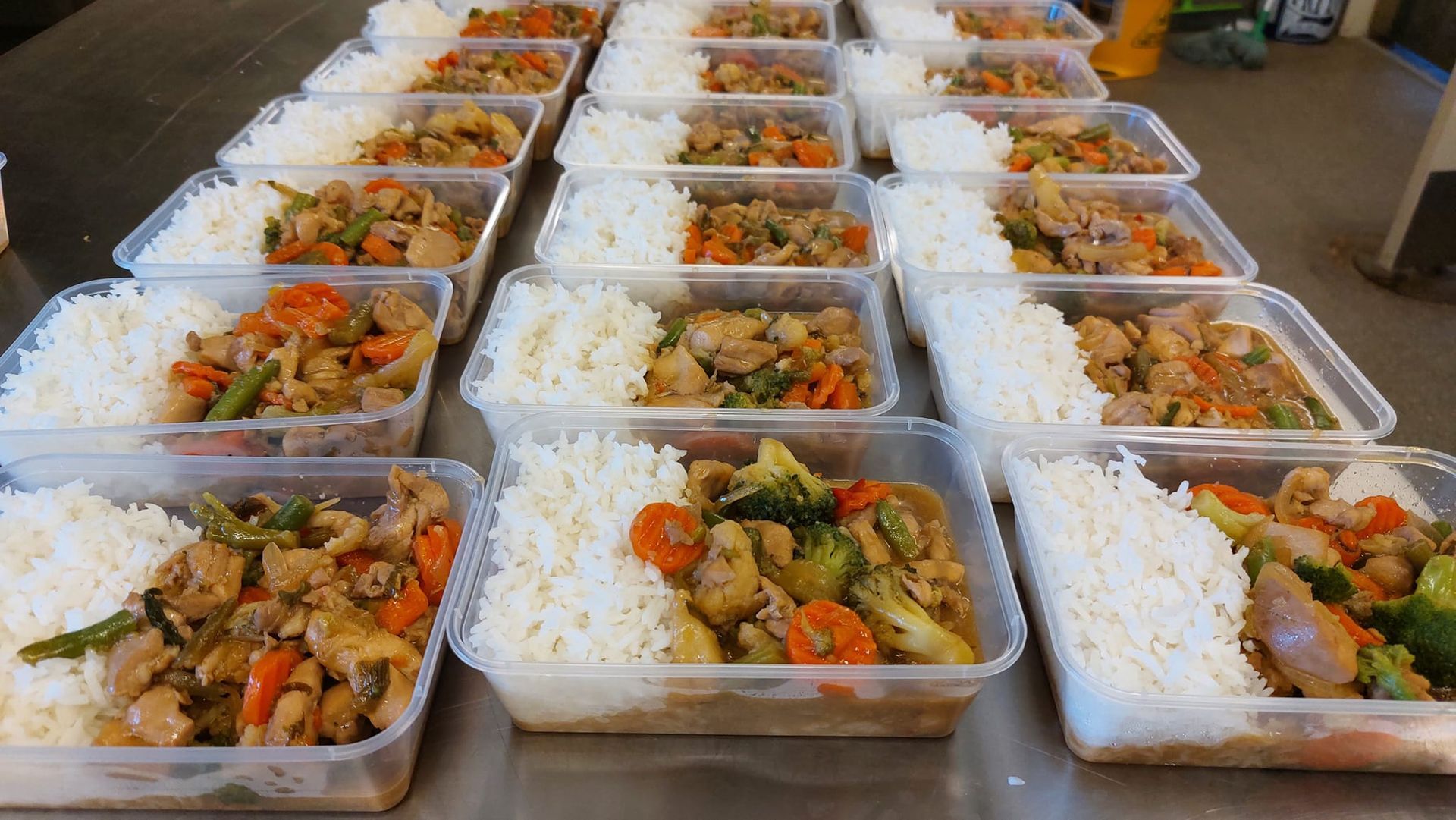 Rows of Plastic Meal Containers Filled With White Rice and a Stir-fry of Chicken — Tre's Food To You in Mount Sheridan, QLD