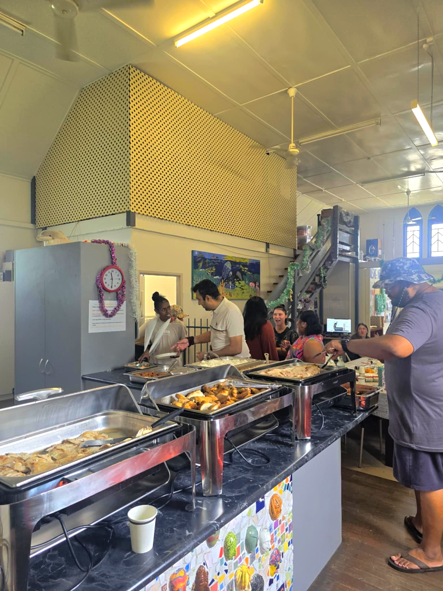 People Serving Themselves Food From a Buffet Line — Tre's Food To You in Mount Sheridan, QLD