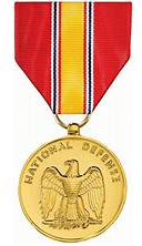National Defense Service Medal with red, yellow, and blue striped ribbon.
