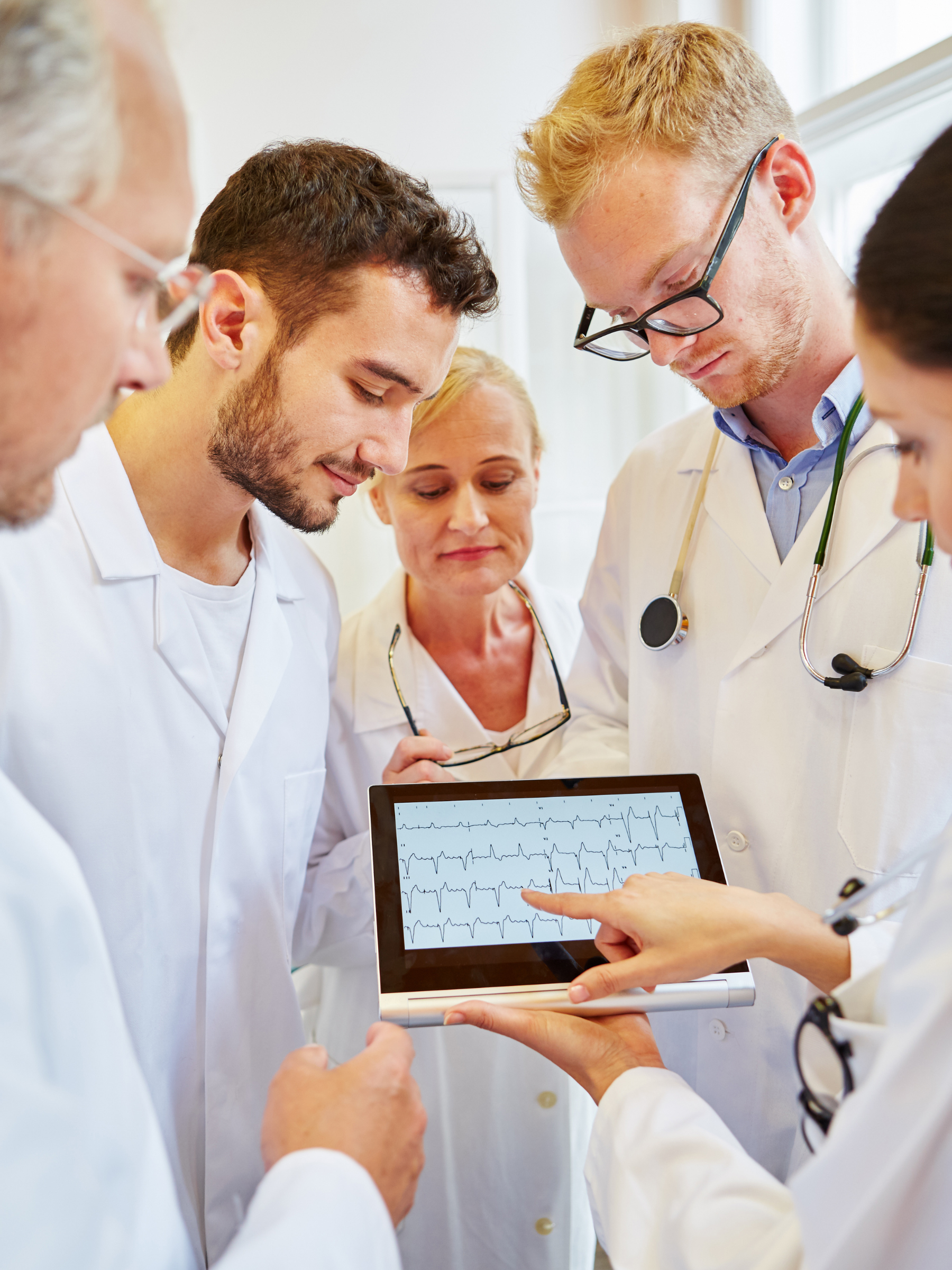 Clinical team reviewing an ECG tracing