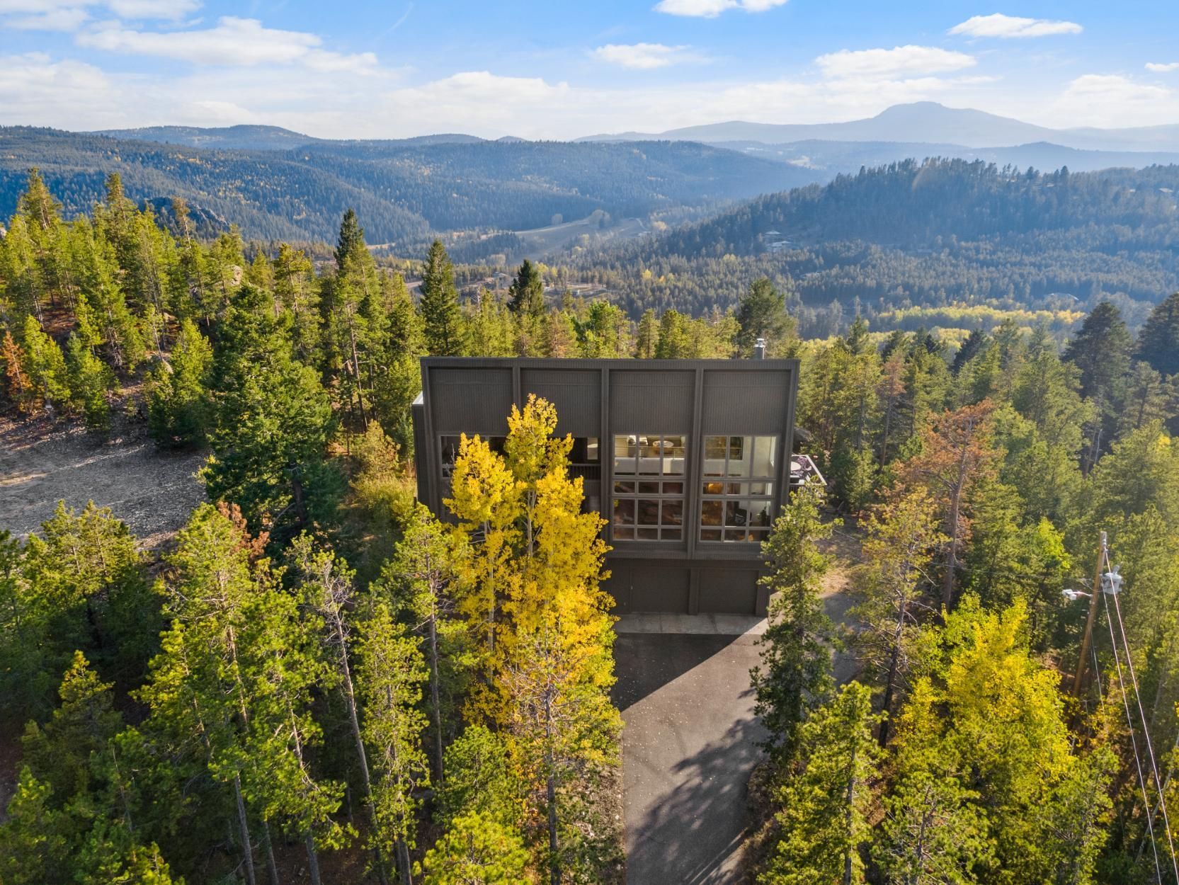 aerial photo of wooded home