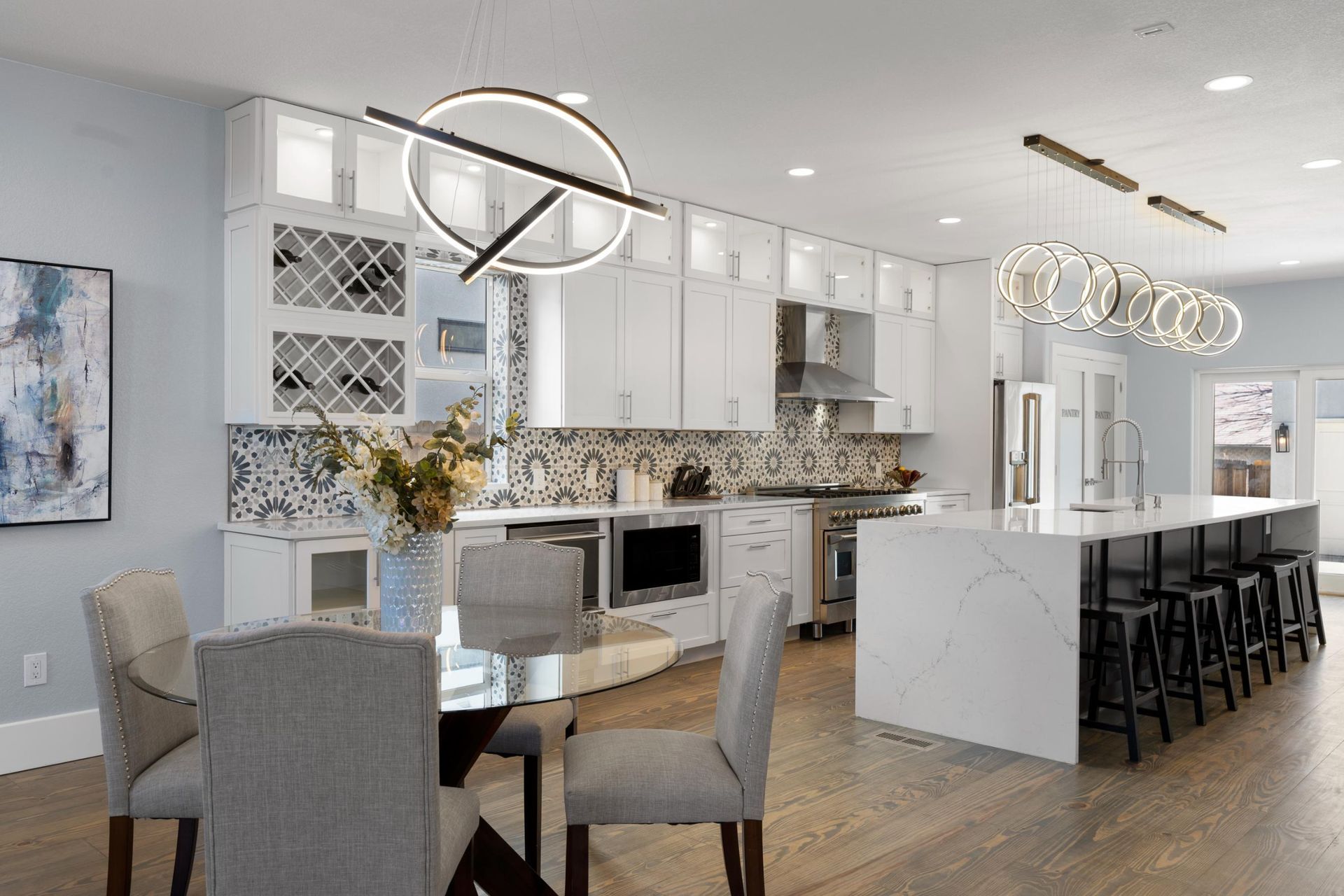 there is a large island in the middle of the kitchen .