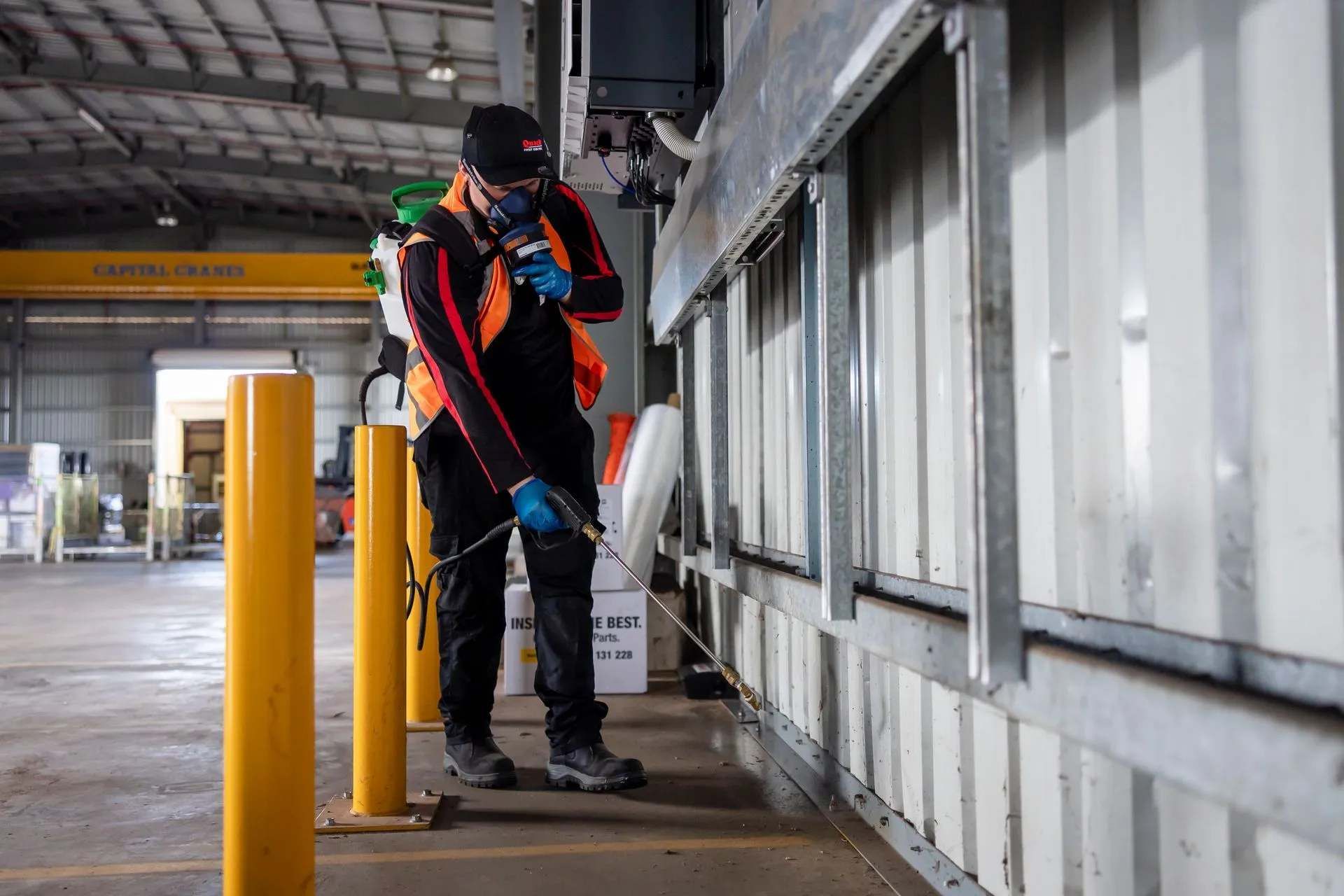 Worker Performing Pest Control In Darwin