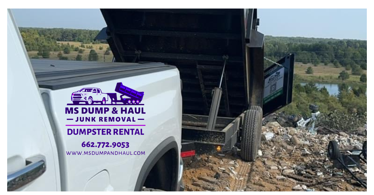 A white dump truck is parked on top of a pile of trash.