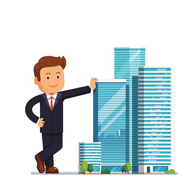 A professional in a suit leaning against a cluster of modern glass skyscrapers.