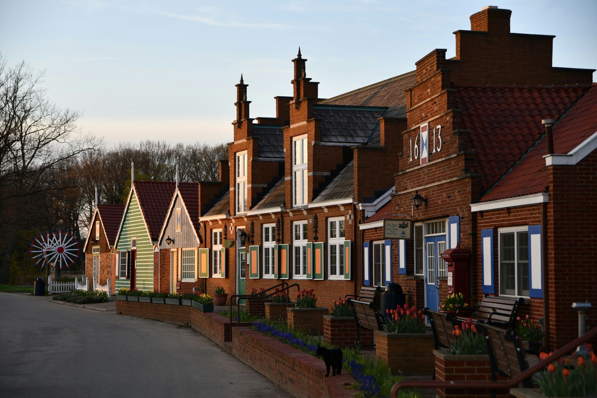 Row of red-brick houses along a quiet street at dusk