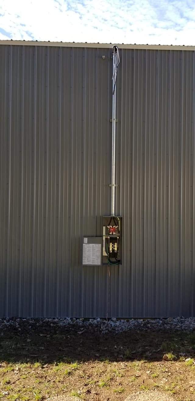 Electrical service box installed on metal commercial building by NS Electric