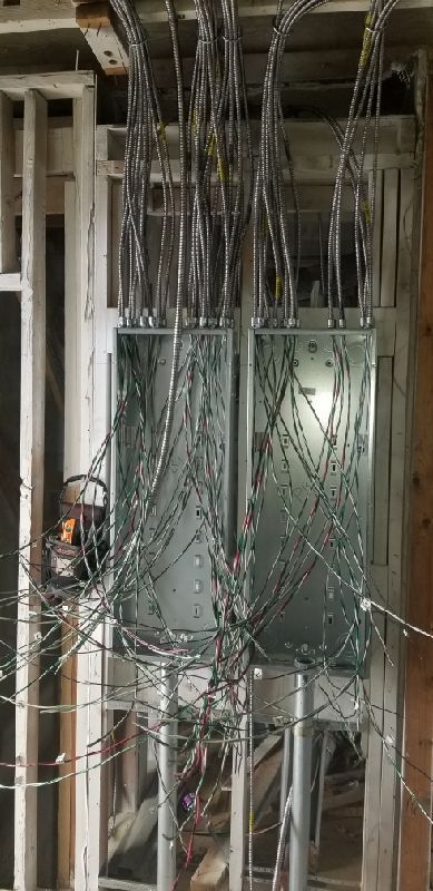 Office breaker boxes being installed during commercial buildout by NS Electric