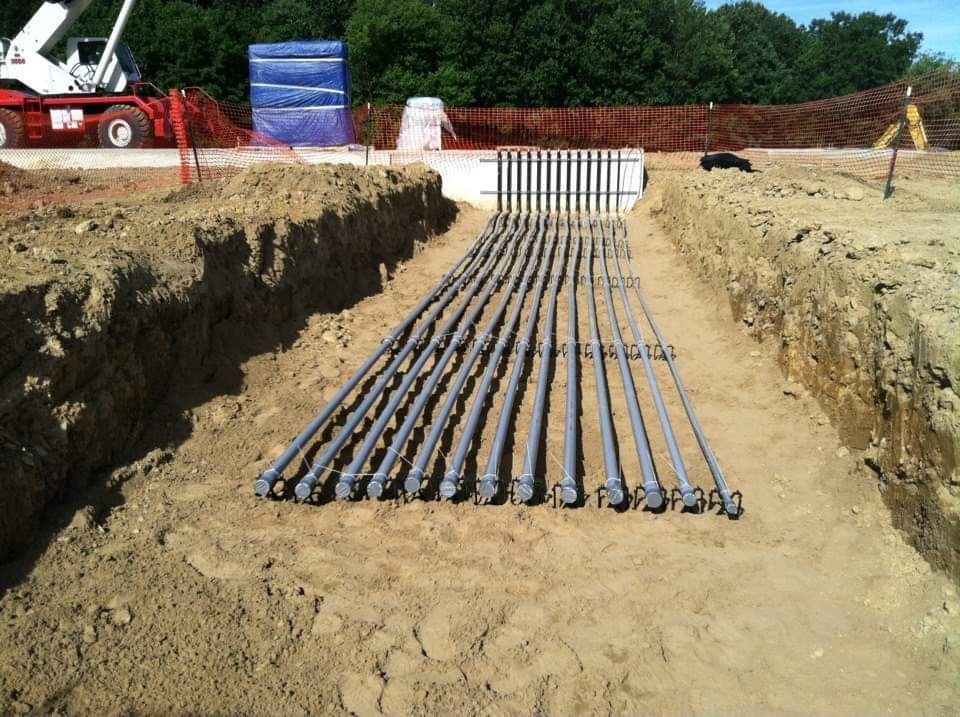 Underground electrical conduit pipes in place at industrial job site