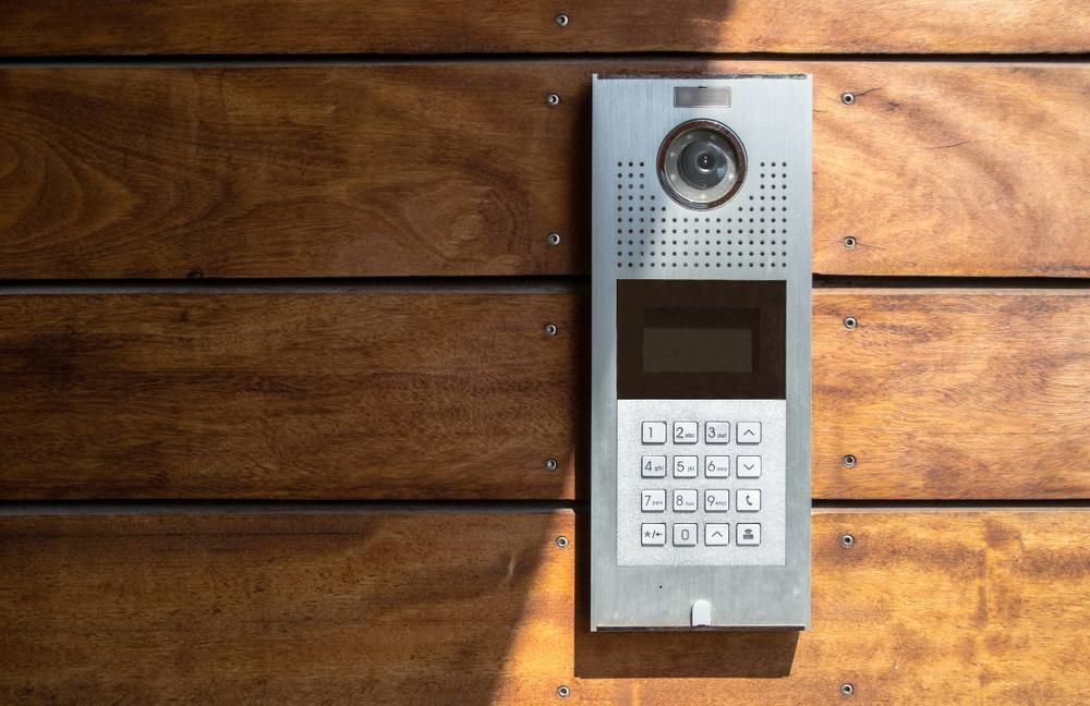 A Doorbell Is Mounted on A Wooden Wall — Byron & Beyond Fencing In Billinudgel, NSW 