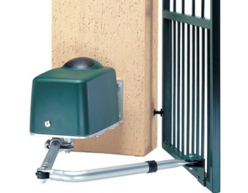 A Green Box Is Mounted to A Wall Next to A Gate — Byron & Beyond Fencing In Billinudgel, NSW