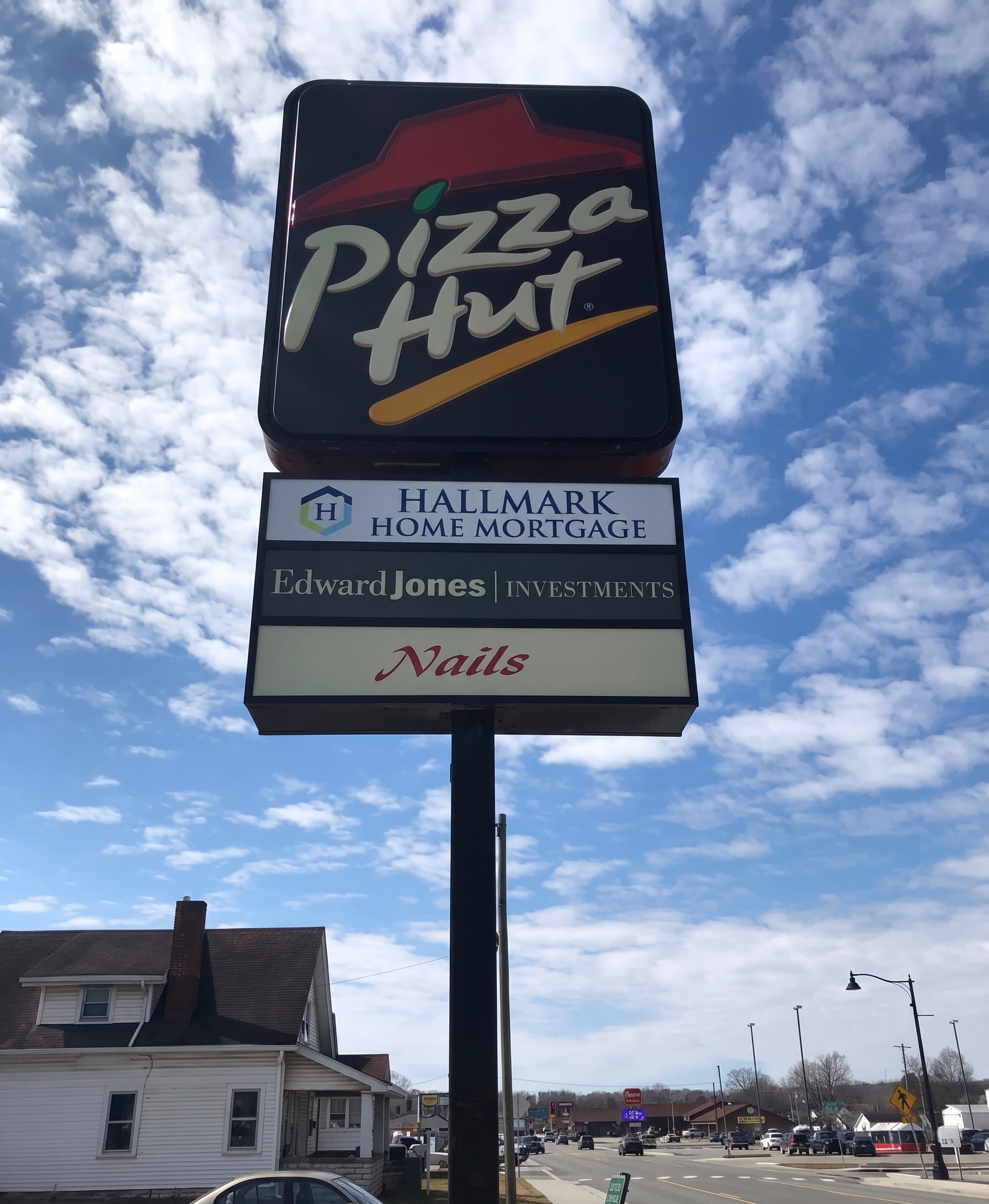 Promotional displays: flagpole banner, cylindrical display, pop-up, and A-frame sign
