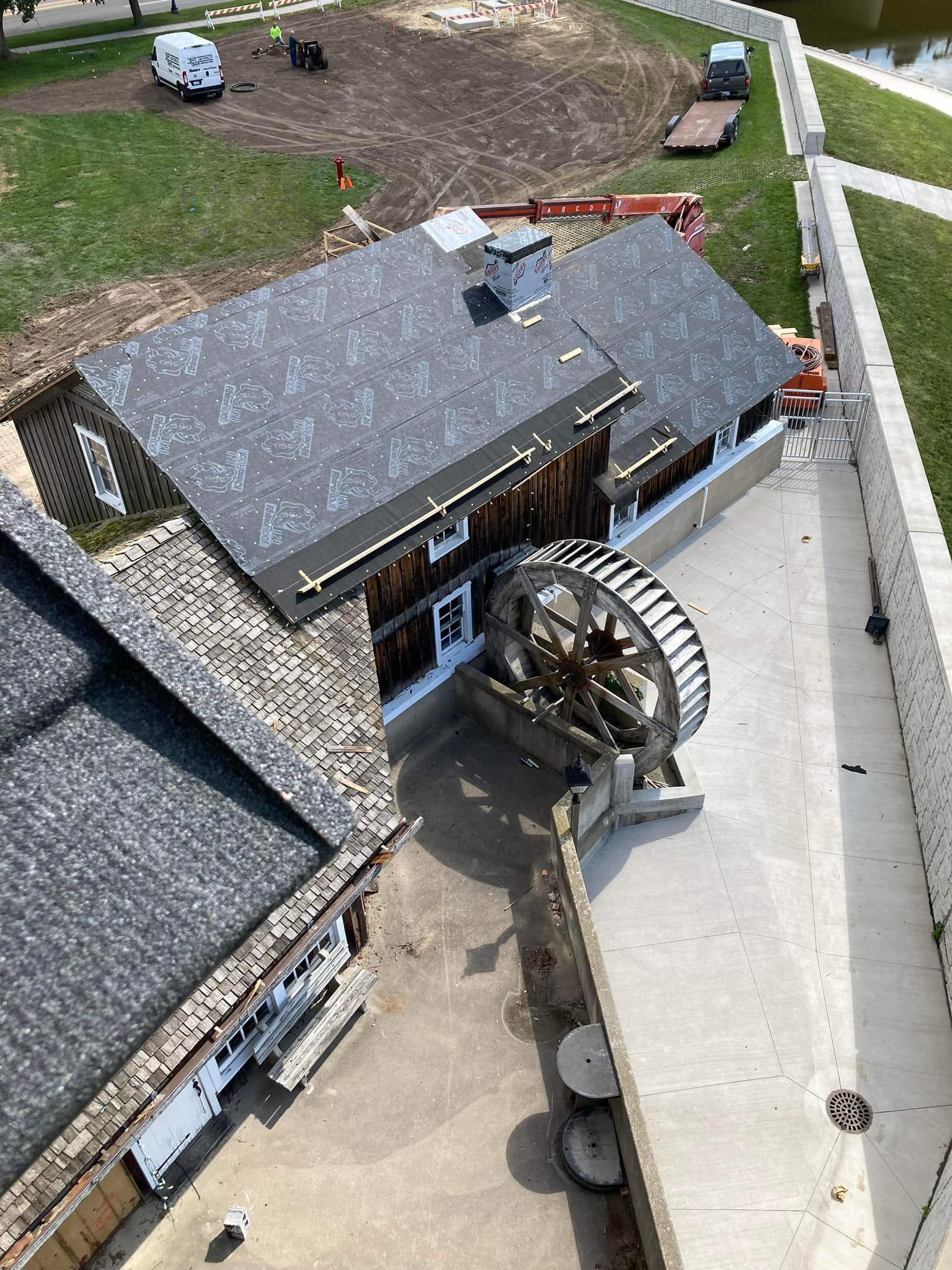 An aerial view of a house with a roof that is being built.