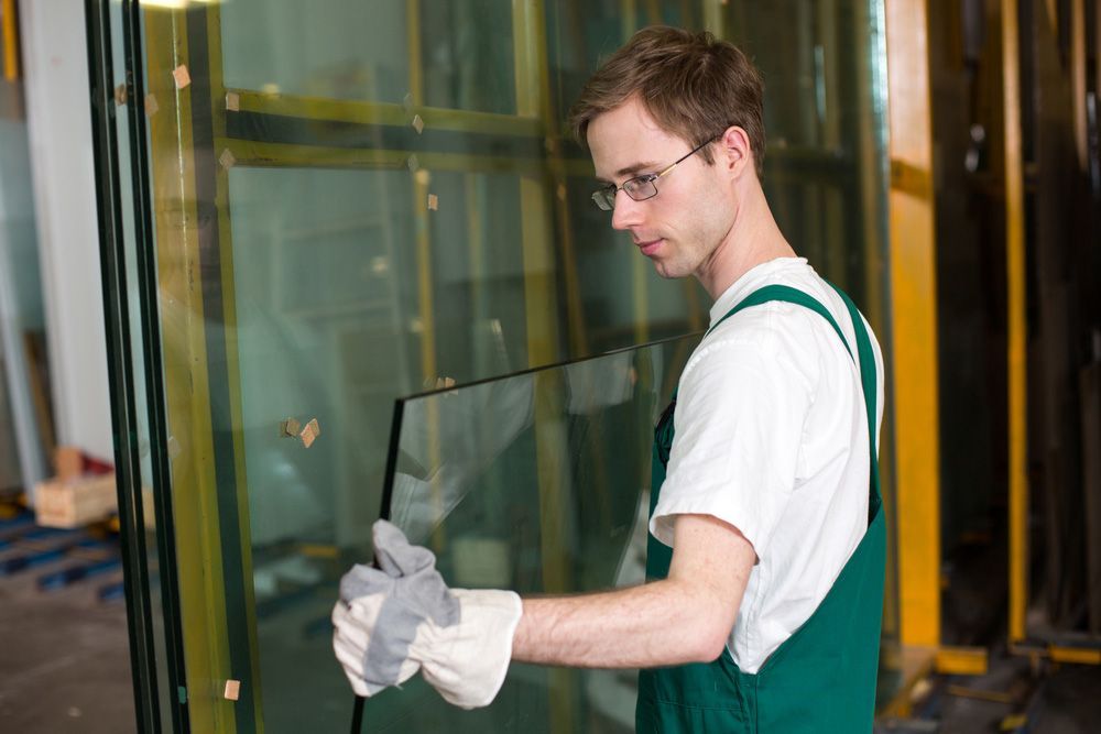Worker In Glazier's Workshop And Warehouse — Glass Repairs & Installations in Tamworth, NSW