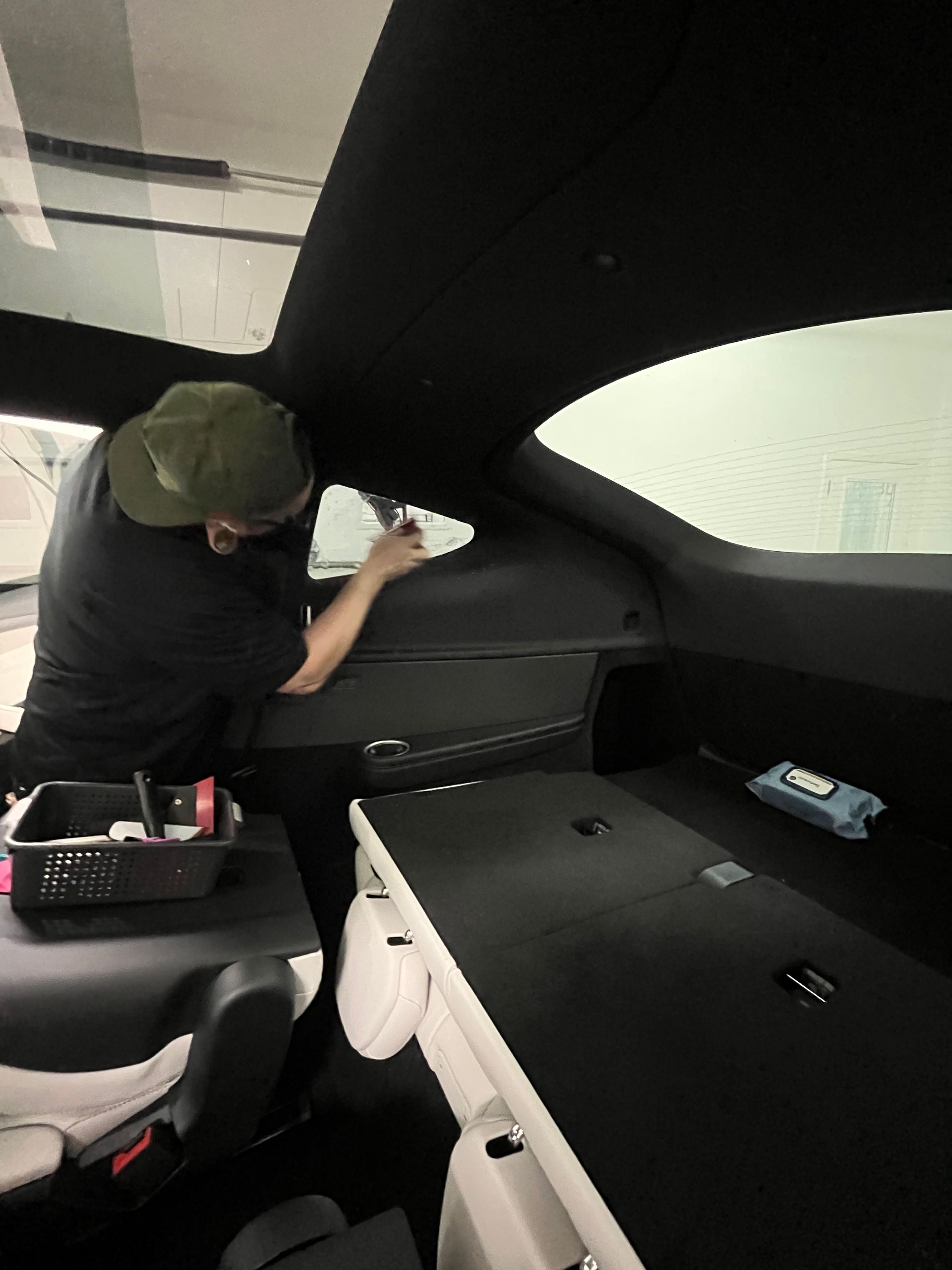 Six-seat interior of 2027 Tesla Model Y L during window tint installation