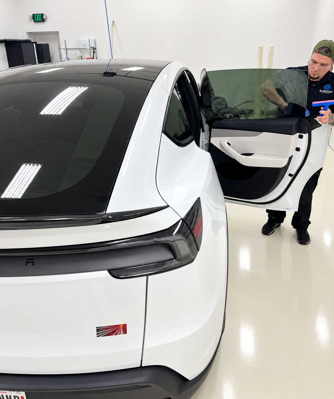 XPEL PRIME XR Plus window tint installation on white 2027 Tesla Model Y L