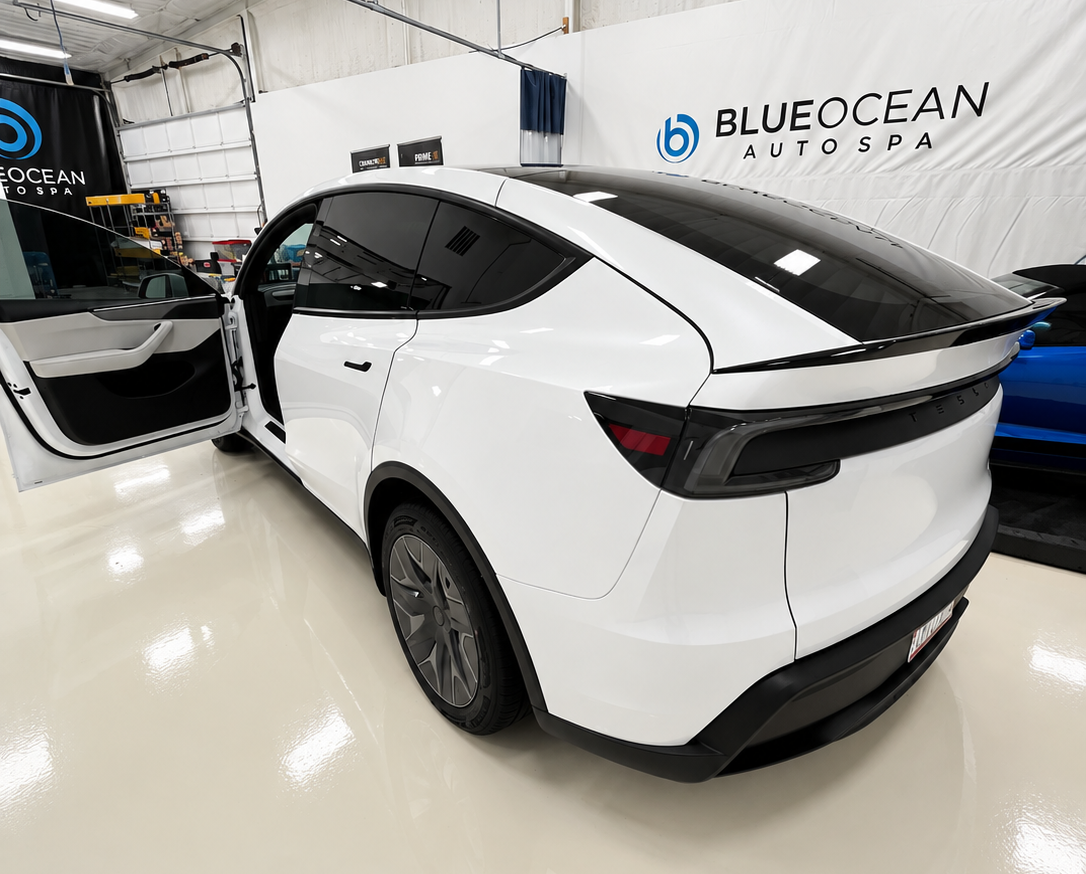 Finished white 2027 Tesla Model Y L with XPEL XR Plus ceramic window tint
