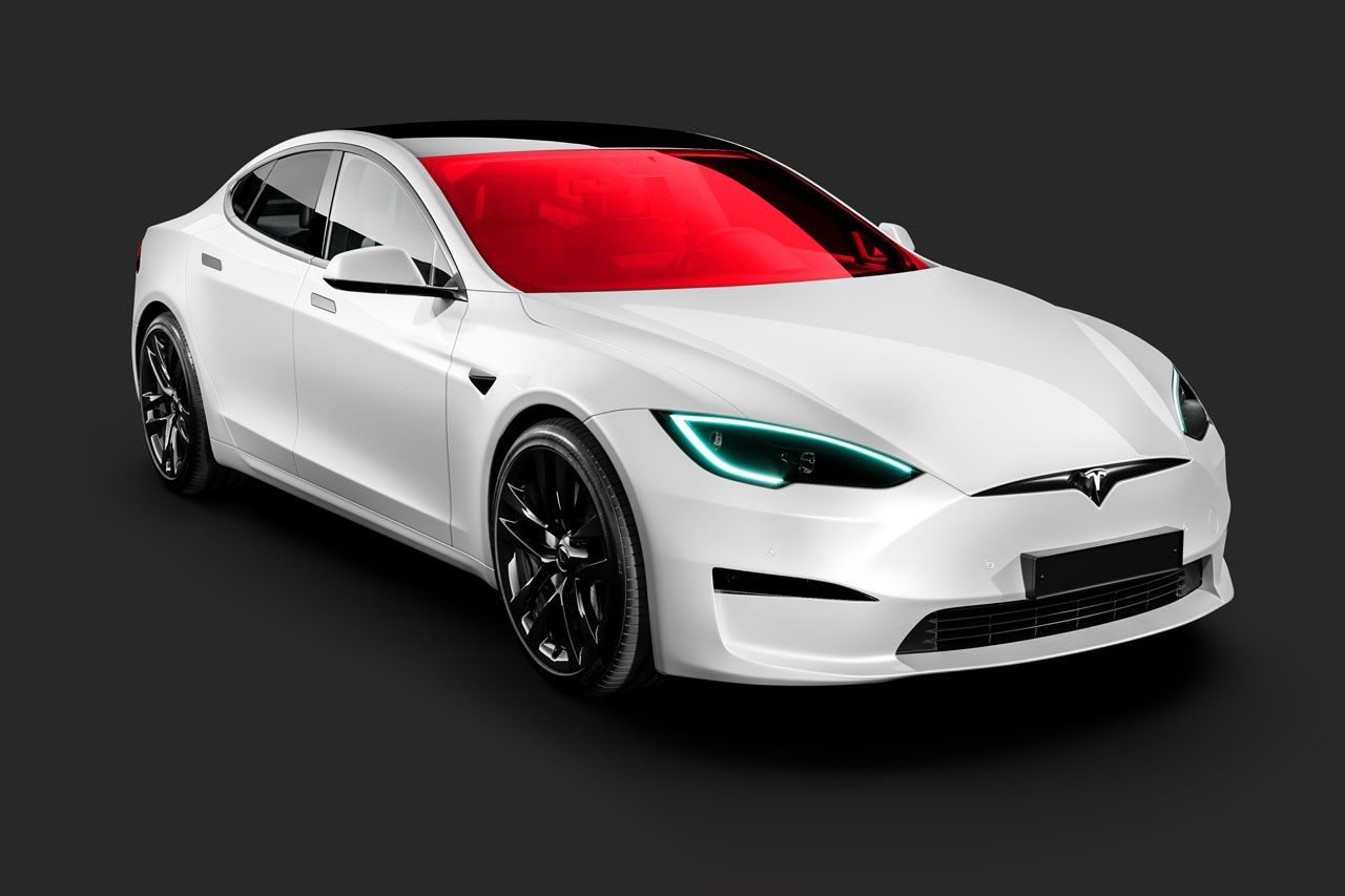 A white tesla model s with a blue windshield on a black background.