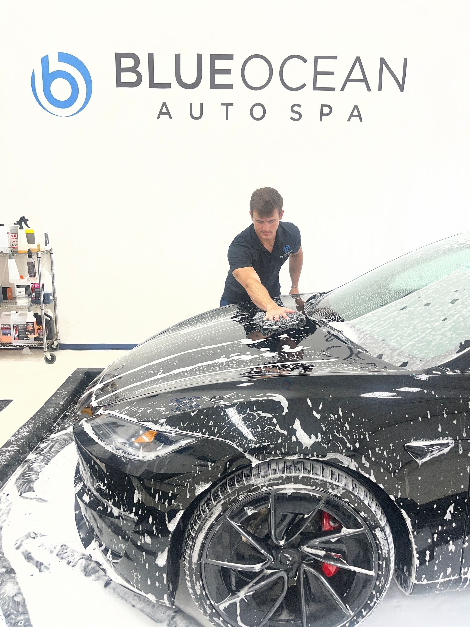 Thick foam wash during the detailing process on this Tesla Model Y. Proper prep is critical before ceramic coating to ensure maximum bonding and long-term durability.