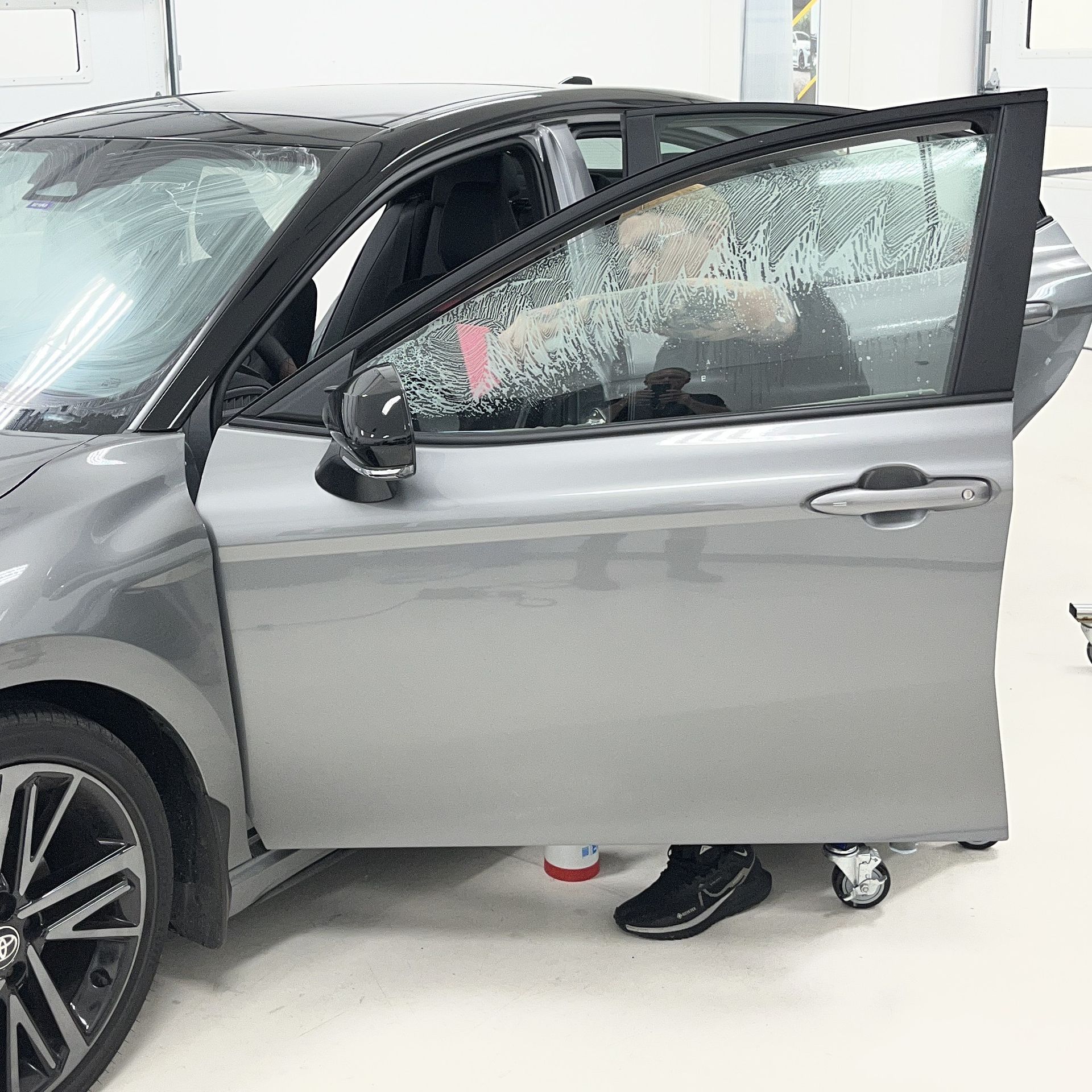 XPEL XR Plus window film being installed on a 2026 Toyota Camry Hybrid
