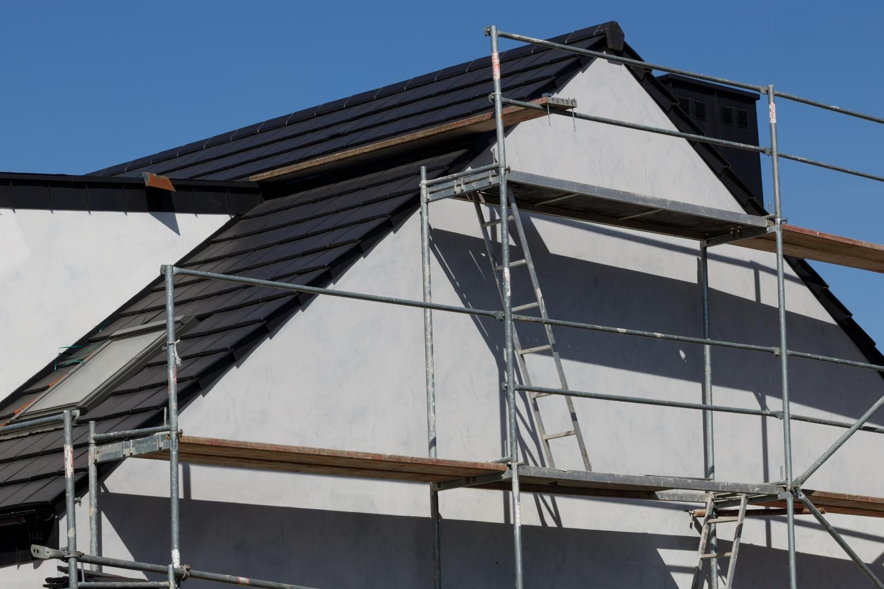 A House is Being Built With Scaffolding Around It  — Mr. Roof Tiles in Kingscliff, NSW